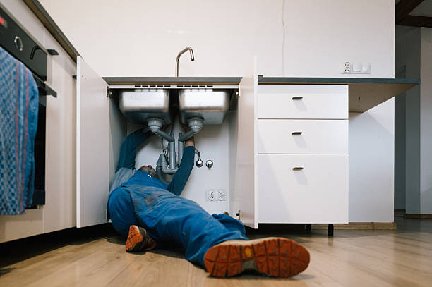 Professional Drain Cleaning technician working in Falkville, AL